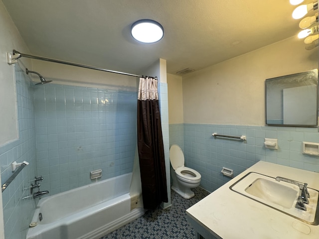 bathroom featuring visible vents, a wainscoted wall, toilet, tile walls, and shower / tub combo