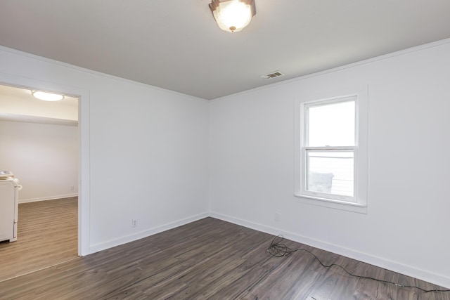 416 Ash St, Lexington, KY 40508 - unfurnished room featuring visible vents, baseboards, washer / dryer, and dark wood-style floors