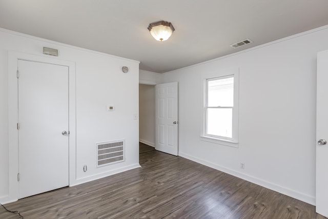 416 Ash St, Lexington, KY 40508 - unfurnished bedroom featuring visible vents, baseboards, wood finished floors, and crown molding