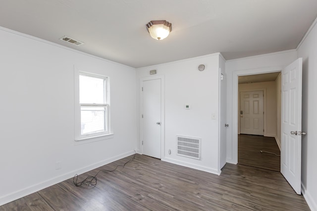 416 Ash St, Lexington, KY 40508 - empty room with visible vents, crown molding, baseboards, and wood finished floors