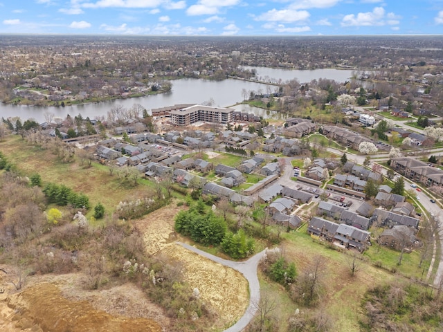 drone / aerial view with a residential view and a water view