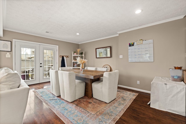 dining area featuring dark wood-style floors, baseboards, french doors, and a textured ceiling