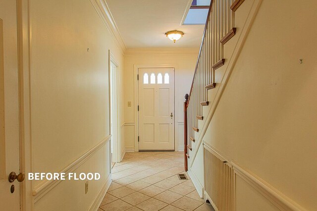 unfurnished room with a baseboard heating unit, hardwood / wood-style flooring, wooden walls, and a baseboard radiator