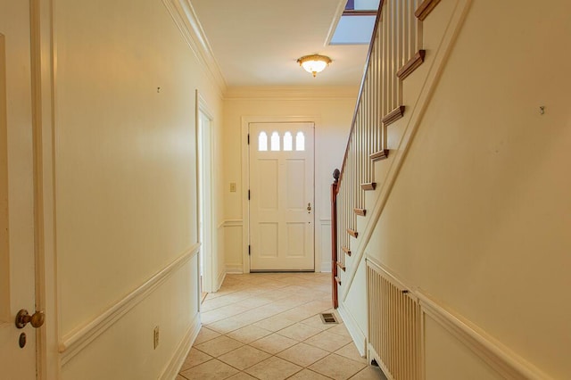 doorway to outside with stairway, visible vents, ornamental molding, and light tile patterned floors