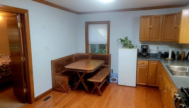 278 John Dr, Burnside, KY 42519 - dining area featuring visible vents, ornamental molding, and light wood finished floors