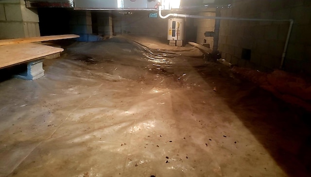 278 John Dr, Burnside, KY 42519 - unfinished below grade area with water heater and concrete block wall