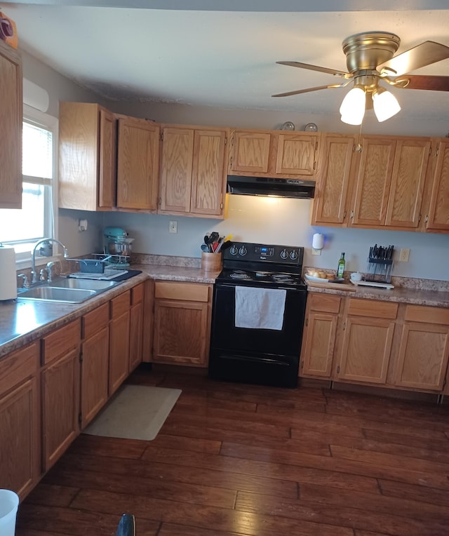 kitchen with a sink, under cabinet range hood, black range with electric stovetop, and dark wood-style floors