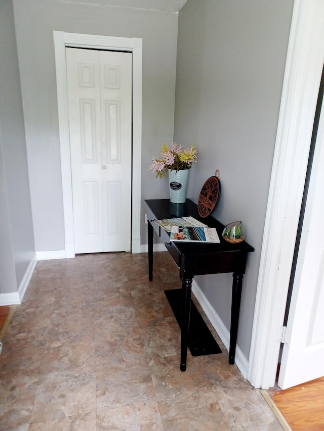 interior space featuring baseboards
