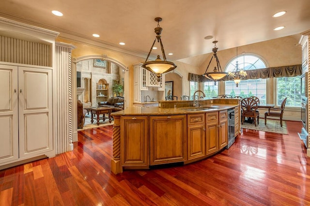 2208 Terranova Ct, Lexington, KY 40513 - kitchen featuring arched walkways, dark wood-style floors, stone counters, and a sink