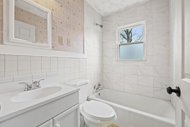 full bath featuring  shower combination, toilet, tile walls, decorative backsplash, and vanity