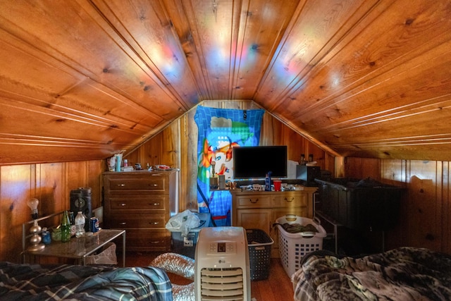 bedroom with wood ceiling, lofted ceiling, wood finished floors, and wooden walls