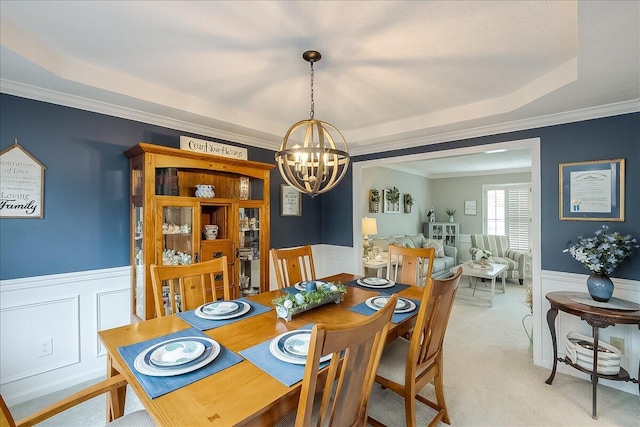 424 Amberley Dr, Lexington, KY 40515 - dining area featuring a wainscoted wall, ornamental molding, and an inviting chandelier