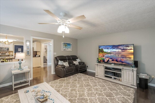 424 Amberley Dr, Lexington, KY 40515 - living area featuring ceiling fan with notable chandelier, wood finished floors, baseboards, and a textured ceiling