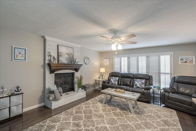 424 Amberley Dr, Lexington, KY 40515 - living area featuring a textured ceiling, wood finished floors, a ceiling fan, and a brick fireplace