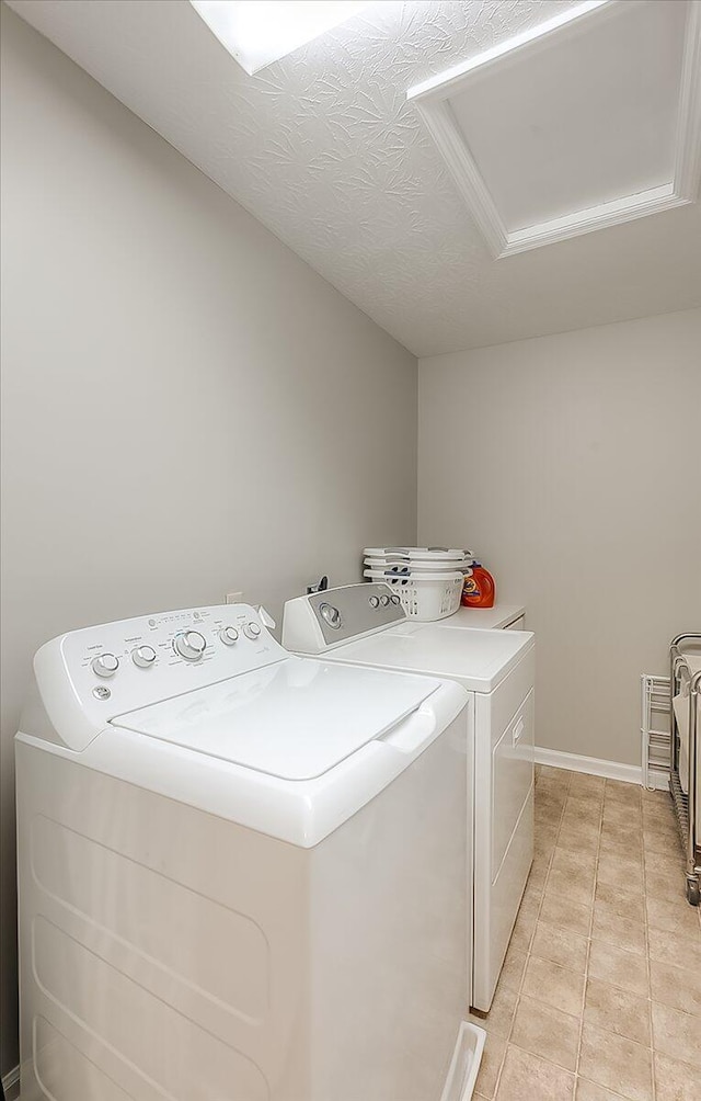 424 Amberley Dr, Lexington, KY 40515 - laundry room featuring light tile patterned floors, washing machine and dryer, attic access, and laundry area