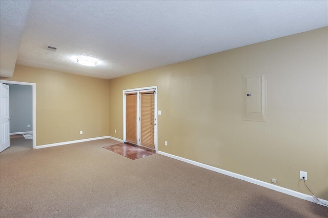 424 Amberley Dr, Lexington, KY 40515 - spare room featuring baseboards, carpet flooring, a textured ceiling, and electric panel