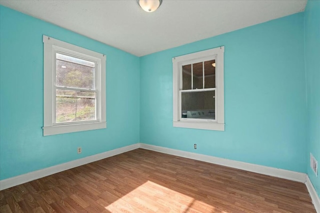 312 Murrell St, Frankfort, KY 40601 - spare room with visible vents, wood finished floors, and baseboards