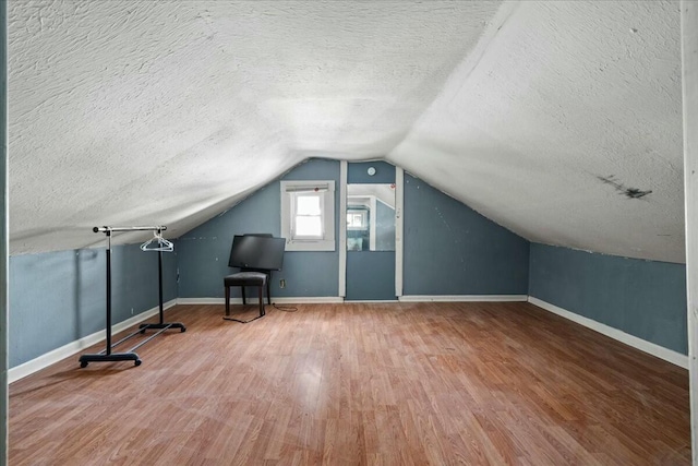 312 Murrell St, Frankfort, KY 40601 - bonus room with baseboards, lofted ceiling, a textured ceiling, and wood finished floors