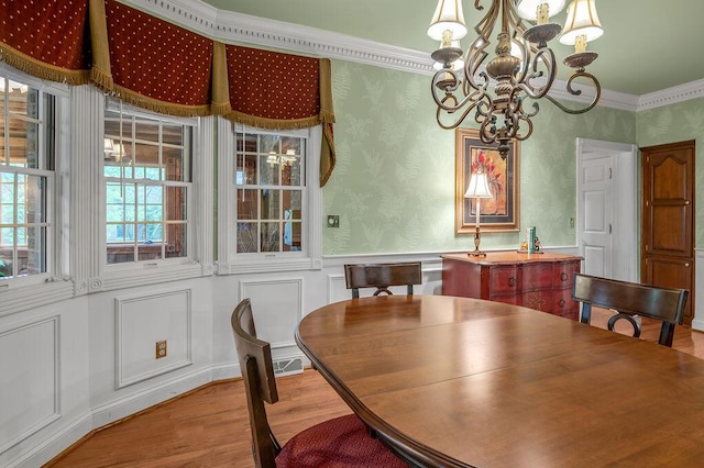 870 Mcmeekin Pl, Lexington, KY 40502 - dining area with a chandelier, wood finished floors, ornamental molding, wainscoting, and wallpapered walls