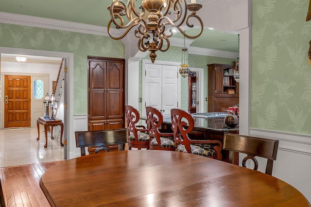 870 Mcmeekin Pl, Lexington, KY 40502 - dining room with wallpapered walls, a chandelier, a wainscoted wall, hardwood / wood-style floors, and ornamental molding