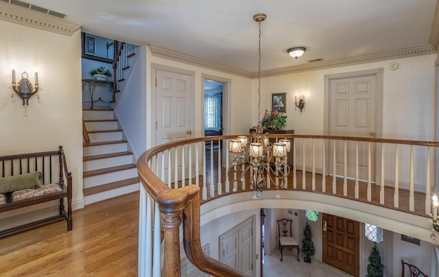 870 Mcmeekin Pl, Lexington, KY 40502 - staircase featuring a chandelier, wood finished floors, and arched walkways