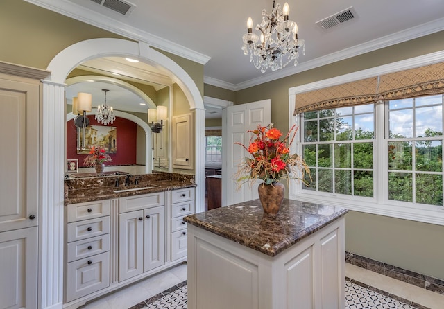 870 Mcmeekin Pl, Lexington, KY 40502 - bathroom with a chandelier, tile patterned flooring, vanity, and ornamental molding