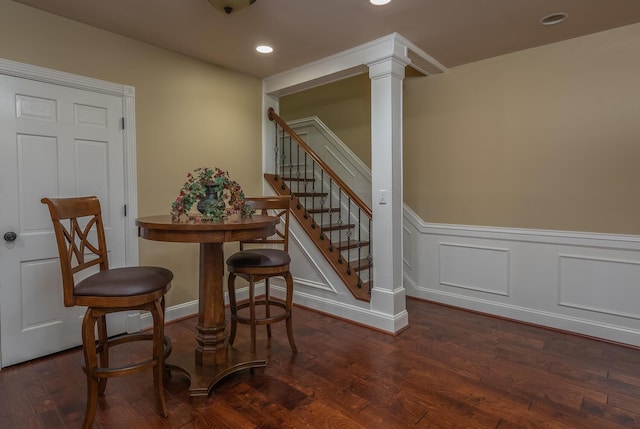870 Mcmeekin Pl, Lexington, KY 40502 - dining space featuring a wainscoted wall, recessed lighting, wood finished floors, stairway, and decorative columns