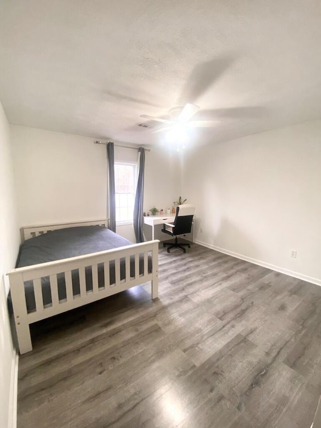 6372 S US-127, Liberty, KY 42539 - unfurnished bedroom with baseboards, wood finished floors, and a ceiling fan
