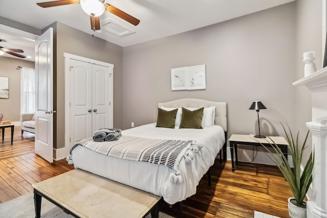 bedroom with a ceiling fan, a closet, and hardwood / wood-style floors