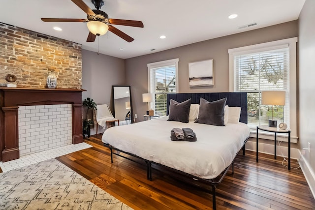 bedroom featuring wood-type flooring, recessed lighting, and visible vents
