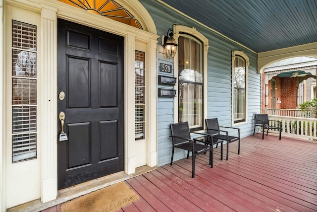 doorway to property featuring a porch
