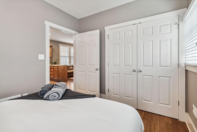 bedroom with a closet and wood finished floors