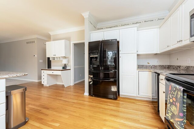 kitchen featuring black appliances, light wood-style floors, white cabinetry, crown molding, and tasteful backsplash