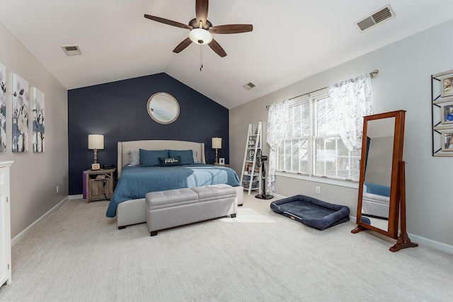 carpeted bedroom featuring vaulted ceiling, baseboards, visible vents, and ceiling fan