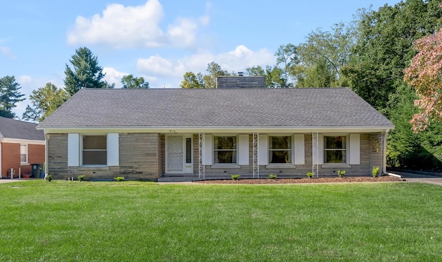 ranch-style house featuring stone siding, a chimney, a front yard, and a shingled roof