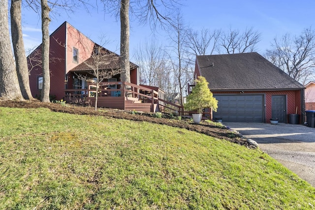 380 Harrodswood Rd, Frankfort, KY 40601 - view of side of home featuring a garage, gravel driveway, a lawn, and roof with shingles