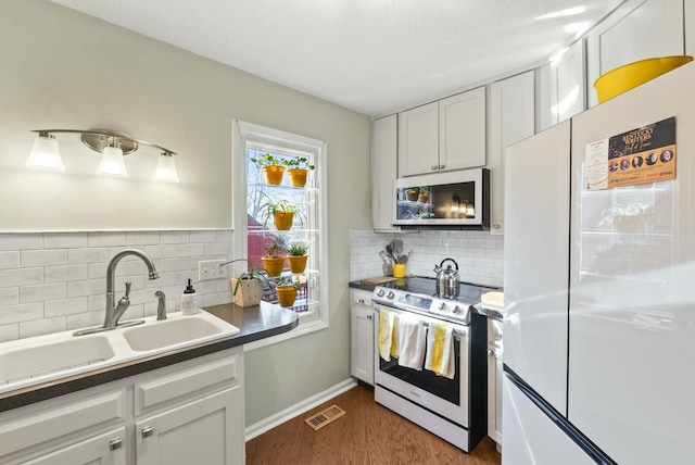 380 Harrodswood Rd, Frankfort, KY 40601 - kitchen with a sink, white cabinets, freestanding refrigerator, and electric range oven
