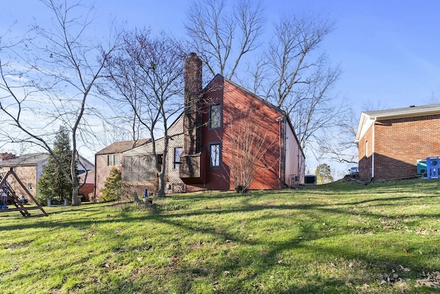 380 Harrodswood Rd, Frankfort, KY 40601 - view of property exterior featuring a chimney and a yard