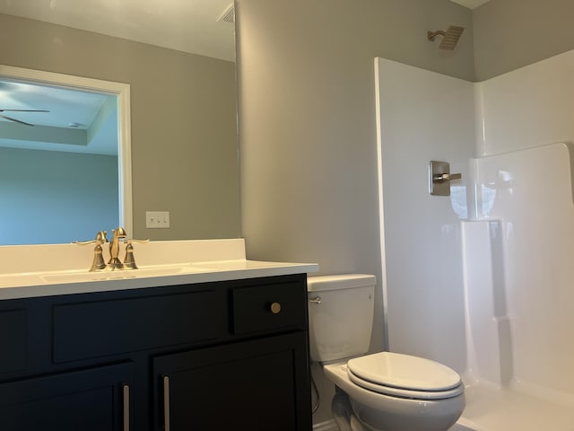 bathroom featuring visible vents, walk in shower, vanity, and toilet