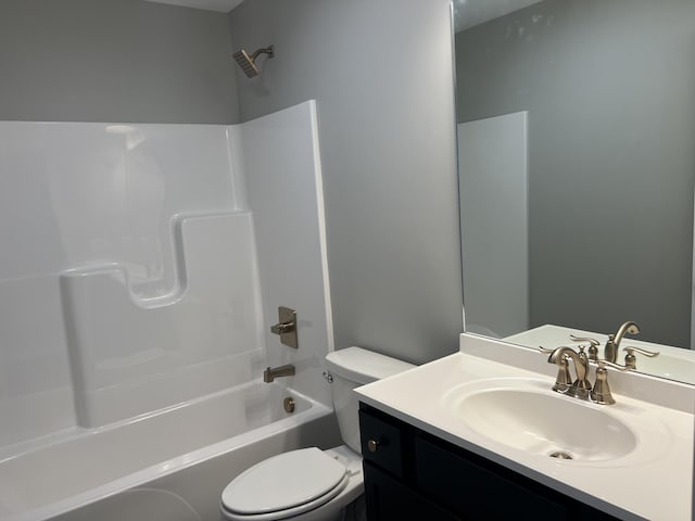 full bathroom featuring bathtub / shower combination, vanity, and toilet