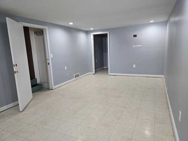empty room featuring recessed lighting, visible vents, baseboards, and light floors