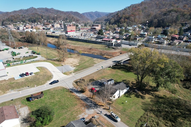 bird's eye view with a water and mountain view