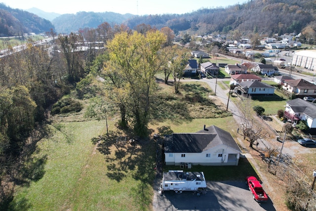 bird's eye view featuring a mountain view and a wooded view