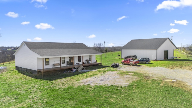 700 Nick Ln, Winchester, KY 40391 - back of house with an outbuilding, a pole building, covered porch, a shingled roof, and a lawn