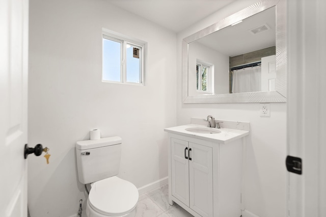 bathroom with toilet, marble finish floor, visible vents, and plenty of natural light