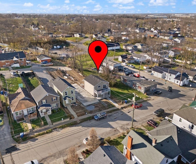 birds eye view of property with a residential view