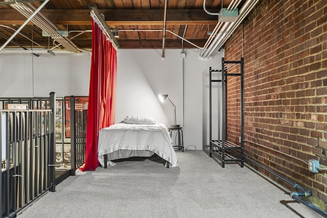 below grade area featuring brick wall, wood ceiling, and carpet flooring