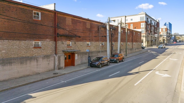 view of road featuring curbs and sidewalks