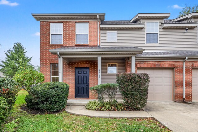 3699 Lochdale Ter, Lexington, KY 40514 - townhome / multi-family property with brick siding, concrete driveway, and a garage