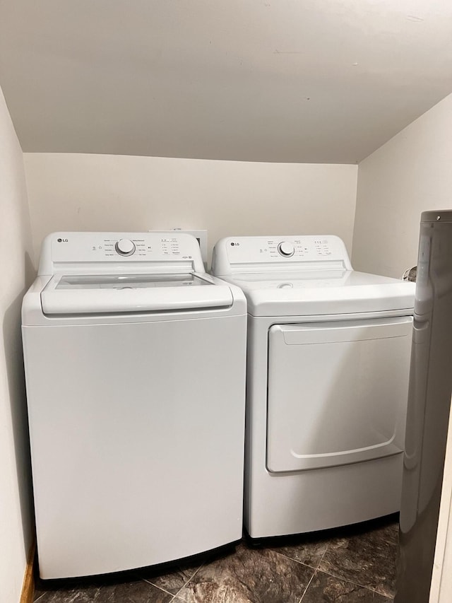 104 First St, Cynthiana, KY 41031 - laundry room with washer and dryer and dark stone finish flooring